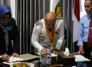Bupati Gusnan Tandatangani MoU Kesepakatan Penanganan Hukum